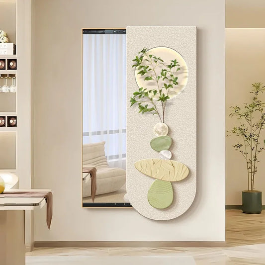 Modern organic wall mirror with pebble-inspired shapes and leaf accents, styled in a minimalist living room with neutral tones.